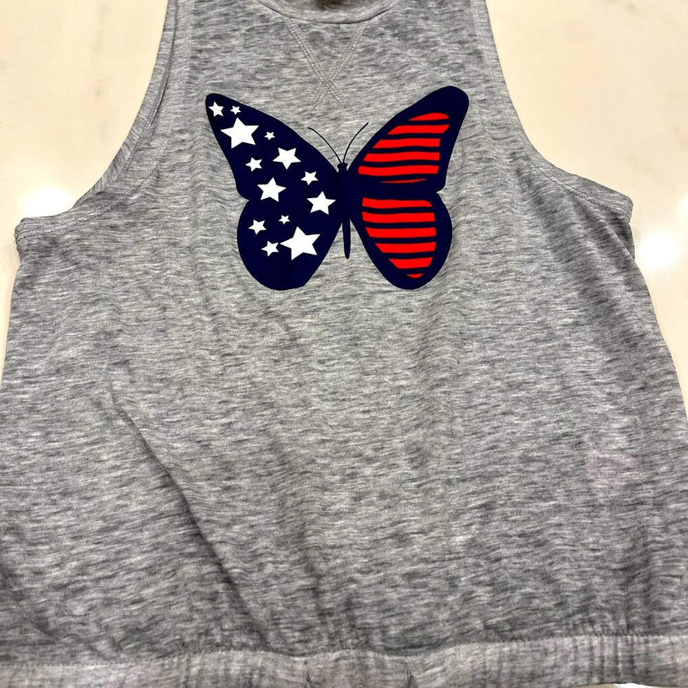 Gray sleeveless t-shirt with red white and blue butterfly and strings on bottom!